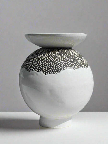 Black and white ceramic vessel front view