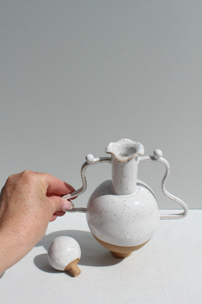 White Vessel with a Wiggle Handle and Stopper