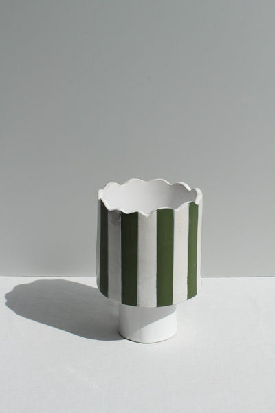 Olive green and white striped vessel or planter top view