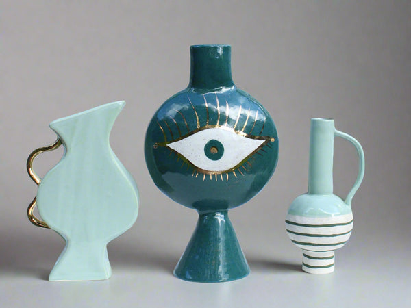 3 green formantics vases
