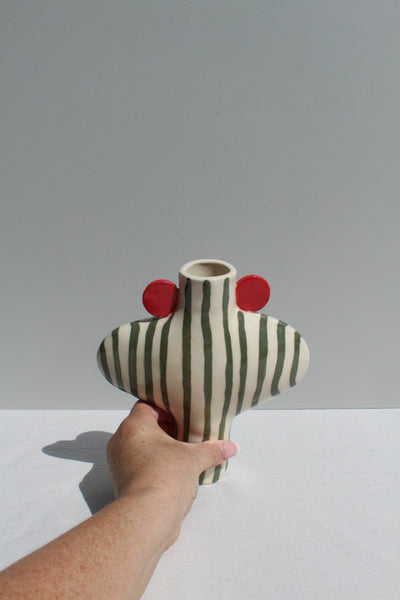 Olive Green striped vessel with red handles, hand for scale