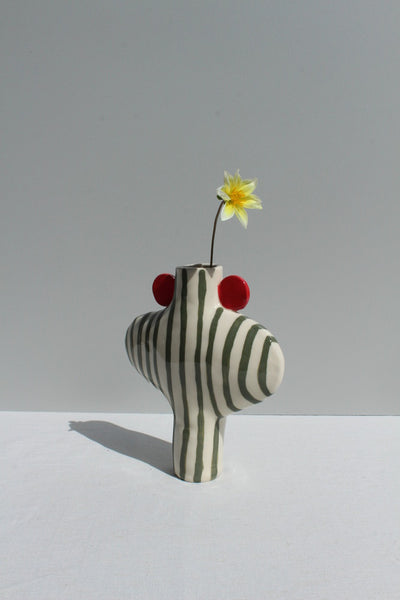 Olive Green striped vessel with red handles, with flower