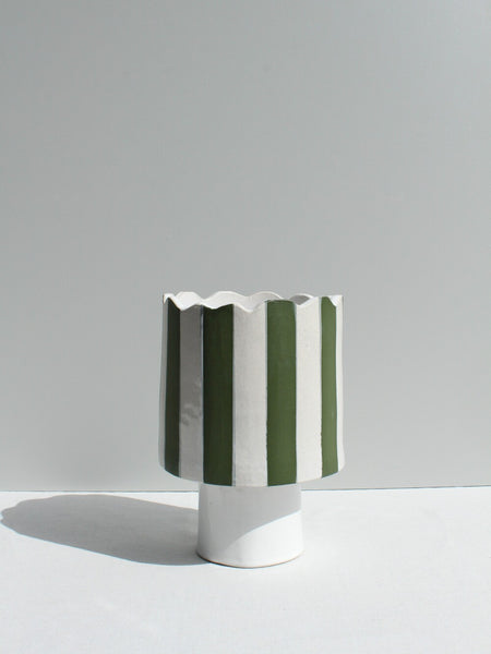 Olive green and white striped vessel or planter