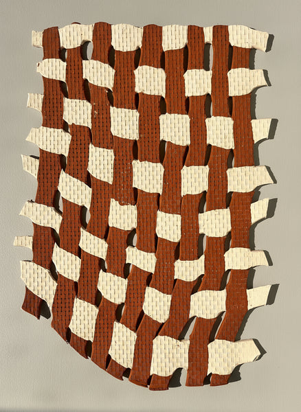 Woven pattern of brown and beige strips on a plain background