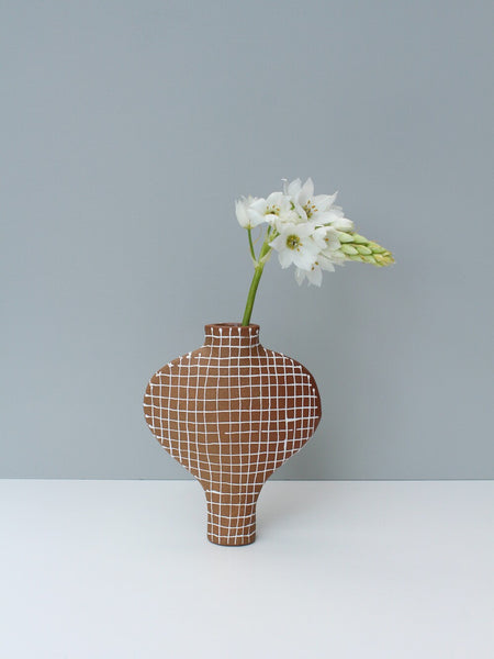 Terracotta White Grid Vessel with a Blue Stopper