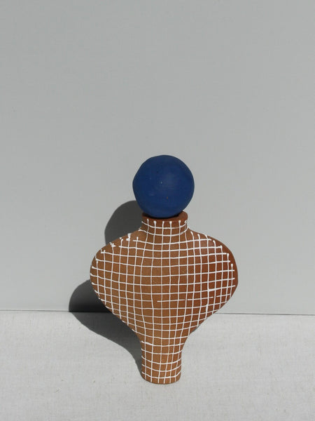 Terracotta White Grid Vessel with a Blue Stopper