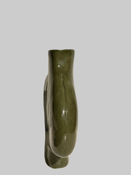 Green ceramic vase on a white background