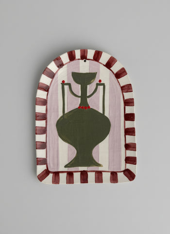 Decorative wall art with a green vase design on a striped background