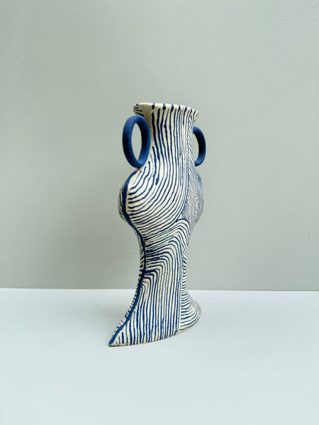 Decorative vase with blue accents on a white background